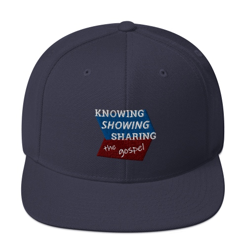 Navy blue snapback hat with Knowing Showing Sharing the gospel on blue and red background