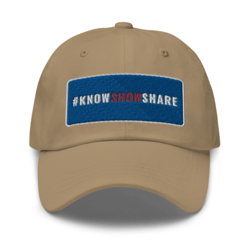 Khaki dad hat with hashtag Know Show Share inside a blue rectangle with white border