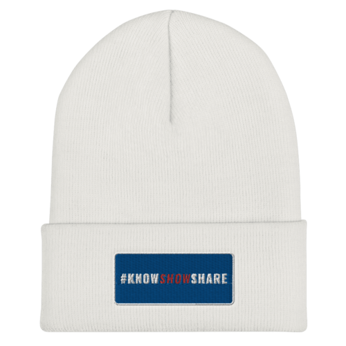 White cuffed beanie with hashtag Know Show Share inside a blue rectangle with white border