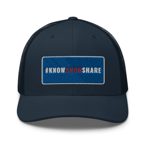 Navy trucker cap with hashtag Know Show Share inside a blue rectangle with white border